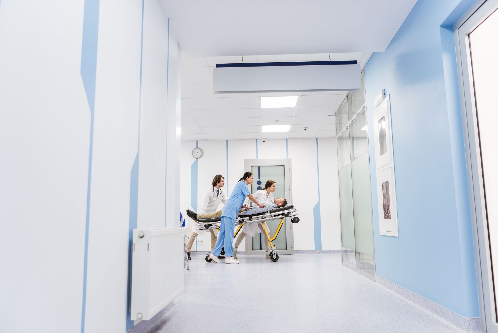 Medical staff and paramedics treating a patient after an accident in Miami — HHA Law personal injury attorneys